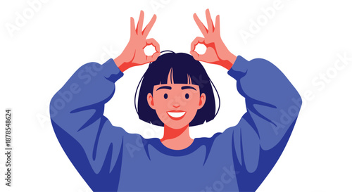 Cheerful young woman making perfect gesture signs over her eyes shows a playful and positive attitude in a blue sweatshirt.