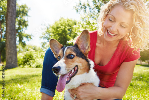 Smile, love and dog with woman in park for connection, bonding and animal adoption. Pet care, loyalty and happiness with person and welsh corgi outdoor for protection, relax and canine companion