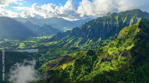 Stunning aerial view of lush green mountains under a bright sky.