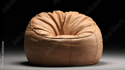 Vintage Brown Leather Bean Bag Chair Isolated on Dark Background

