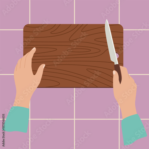 Overhead View of Hands Chopping on a Cutting Board