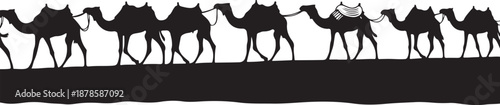 Silhouette of camels walking in a desert landscape formation