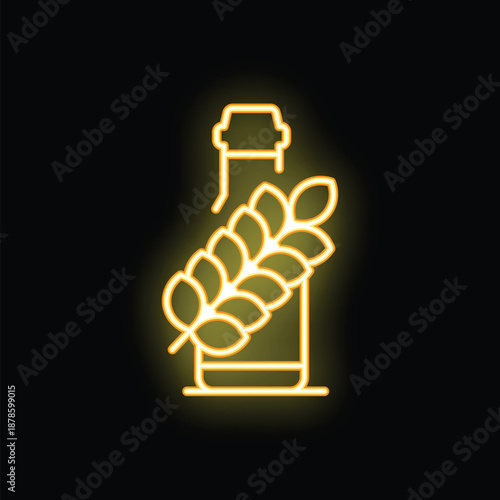 Yellow neon sign of a beer bottle with barley or wheat branch behind it glowing on a black background