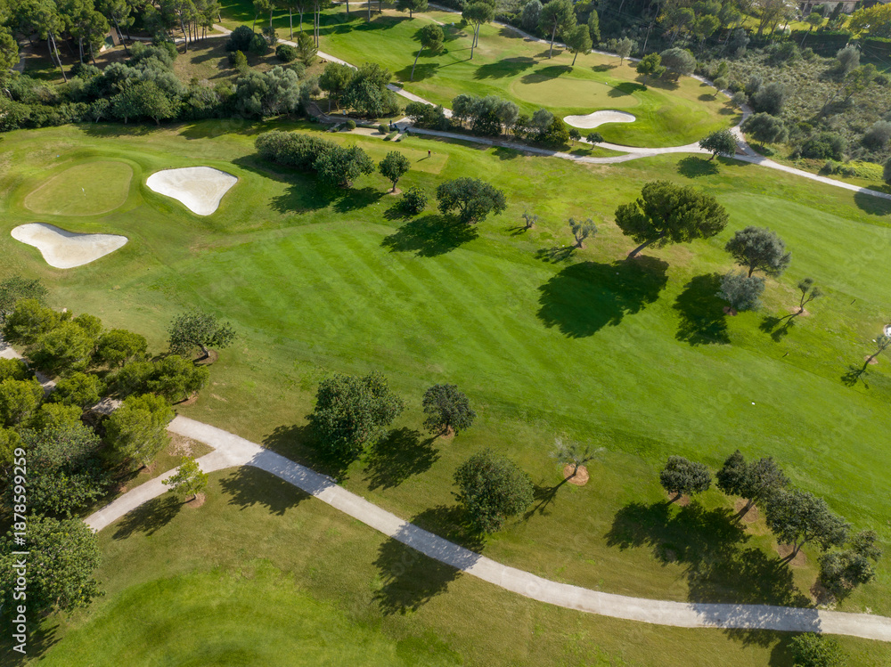 Obraz premium Aerial view, Spain, Balearic Islands, Mallorca, Capdepera, Cuevas de Arta and Platja de Canyamel with golf course, sand bunker, green, golfer