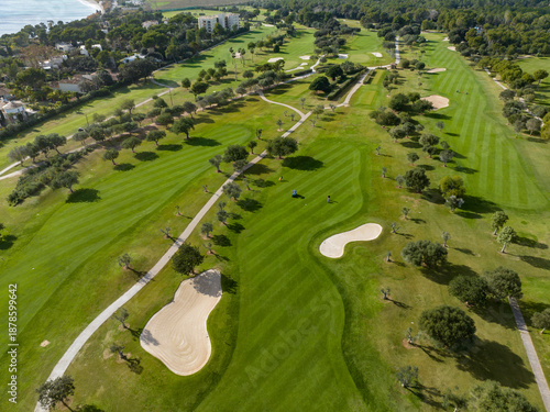 Aerial view, Spain, Balearic Islands, Mallorca, Capdepera, Cuevas de Arta and Platja de Canyamel with golf course, sand bunker, green, golfer