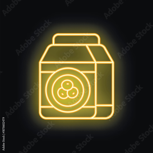 Bright yellow neon sign of a milk or juice carton with a berry illustration is glowing against a black background