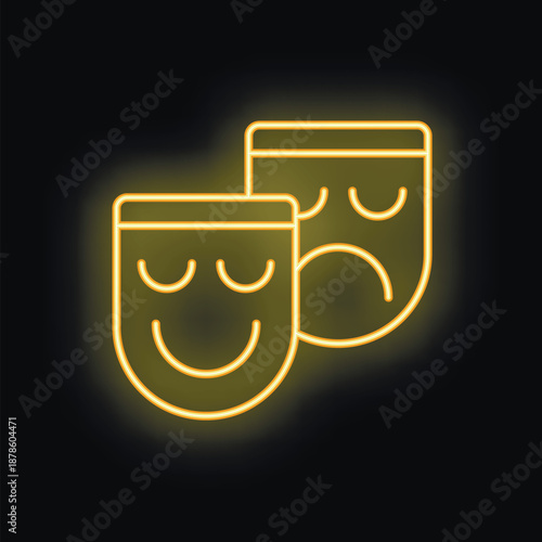 Yellow neon sign representing the comedy and tragedy theater masks, a symbol of the dramatic arts, on a black background
