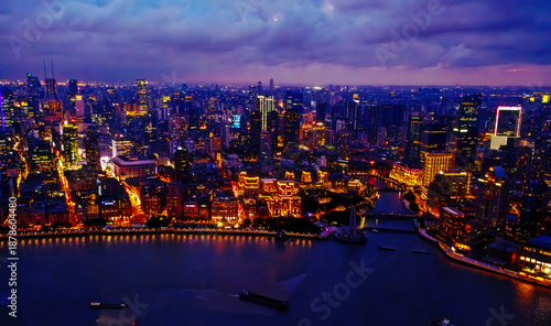 Canvas Print aerial view of the Shanghai city skyline at night illuminated by numerous lights