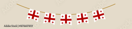 Georgian national flag bunting garland hanging on a string for a patriotic holiday celebration and festive event decoration.