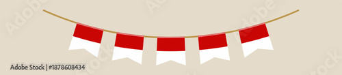 Indonesian flag bunting hanging in a festive garland for celebrating the national independence day and other patriotic holidays.
