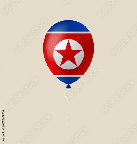 North Korean flag balloon floating as a patriotic national symbol for holiday celebrations on an isolated background.