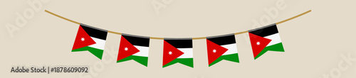 Jordanian flag pennants hanging on a string as a festive garland for a national holiday celebration and patriotic decoration.