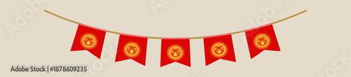Festive Kyrgyzstan flag pennant garland hanging as a decoration for a national holiday or patriotic celebration event.