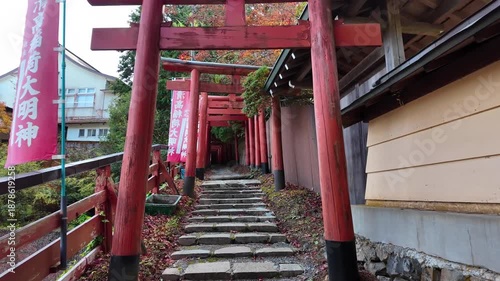 Vibrant Red Torii Gate Welcomes Visitors to Historic Japanese Shrine District