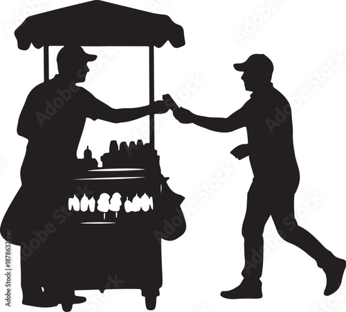 Silhouette of man buying food from street vendor cart
