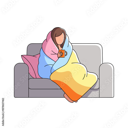 Woman wrapped in colorful blanket drinking tea on cozy sofa  