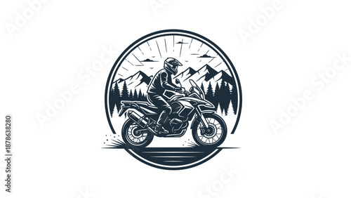 Monochromatic emblem featuring a motorcyclist riding an adventure bike with mountains and trees in the background, illustrating outdoor travel.