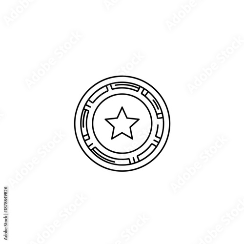 Close-up of a shiny metallic coin featuring a star symbol and intricate border design