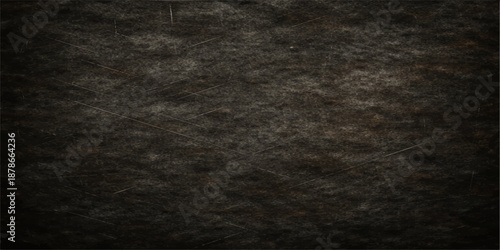 Aged dark grunge paper texture background with a rough vintage wall pattern and blank gray surface canvas for antique art design