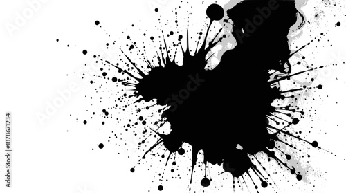 A person sits at a desk working on a computer with a bright screen, an open notebook nearby,