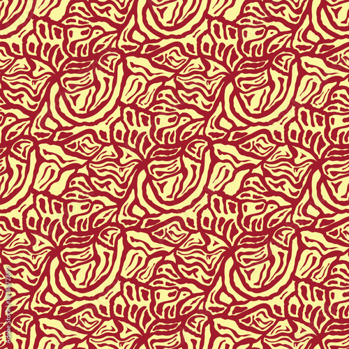 A repeating pattern of abstract red shapes resembling flowers or leaves on a pale yellow background.