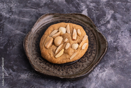 soft cookies with almond macadamia and chocolate on a table and plate