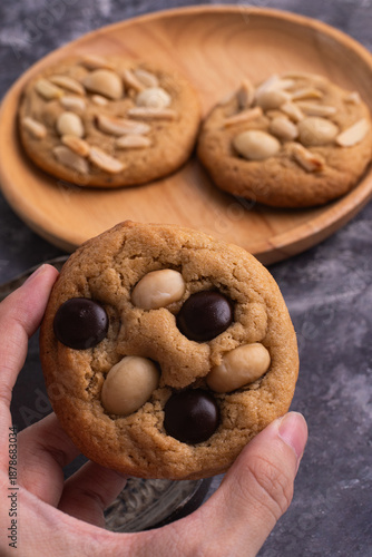 soft cookies with almond macadamia and chocolate on a table and plate