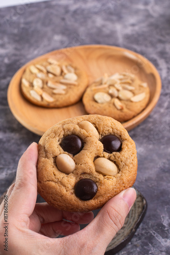 soft cookies with almond macadamia and chocolate on a table and plate