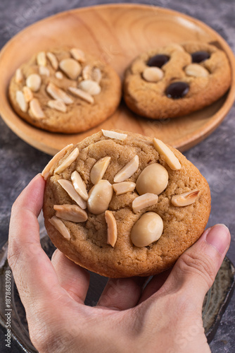 soft cookies with almond macadamia and chocolate on a table and plate