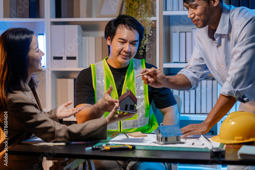 A team of architects and engineers coordinates on an architectural project, reviewing design concepts and technical plans to ensure efficiency and creativity in modern construction development.