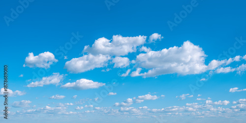 Panoramic background of perfect blue summer sky with beautiful cumulus clouds