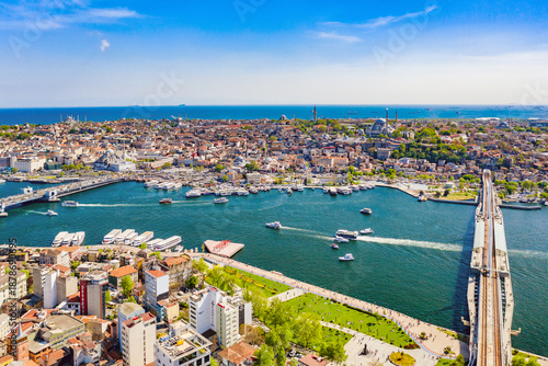 Valokuva Aerial view of Golden Horn bay of Istanbul, Halic bridge and mosques with Sultanahmet district against blue sky and clouds