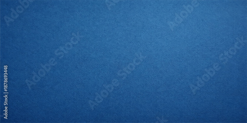 A dark blue vintage denim fabric texture with a rough grunge paper pattern creates a blank cotton textile background and textured canvas surface for a classic wallpaper design