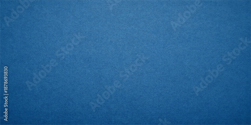 A dark blue vintage denim fabric texture with a rough canvas pattern and grunge textile material design creates a blank weathered wallpaper backdrop