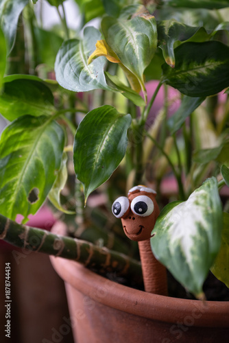 Terracotta worm indicating soil moisture in the potted plant (moist meter)