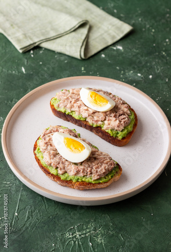 Bruschetta with tuna, avocado and egg. Healthy eating. Breakfast.
