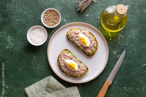 Bruschetta with tuna, avocado and egg. Healthy eating. Breakfast.