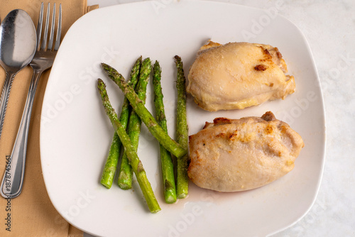chicken thighs derved with asparagus