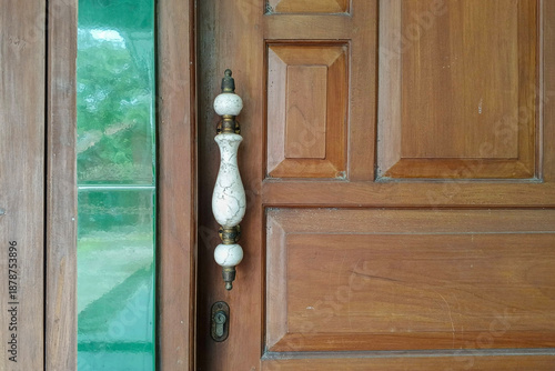 Close up of a classic white ceramic door handle. Vintage and unique door handle. For graphic design, 3D rendering and banners