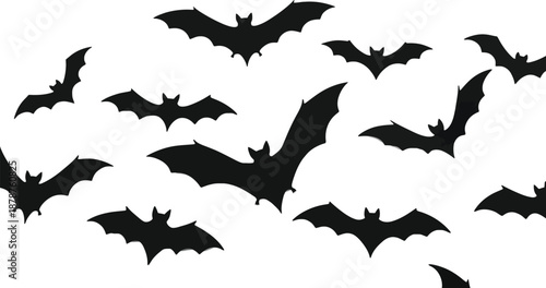 Spooky halloween background with black paper bats flying on a clean white surface