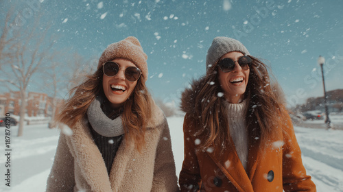 Two friends walking through the snow in style, smiling and having a good time