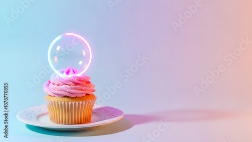 Vibrant cupcake with pink frosting and glowing bubble on plate