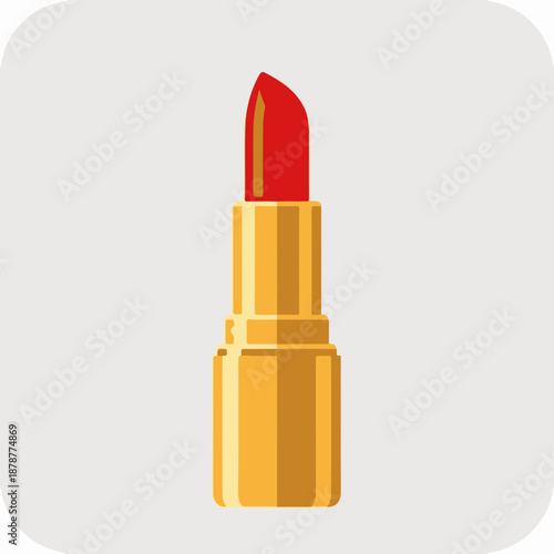 Bright red lipstick in a gold tube on a soft gray background
