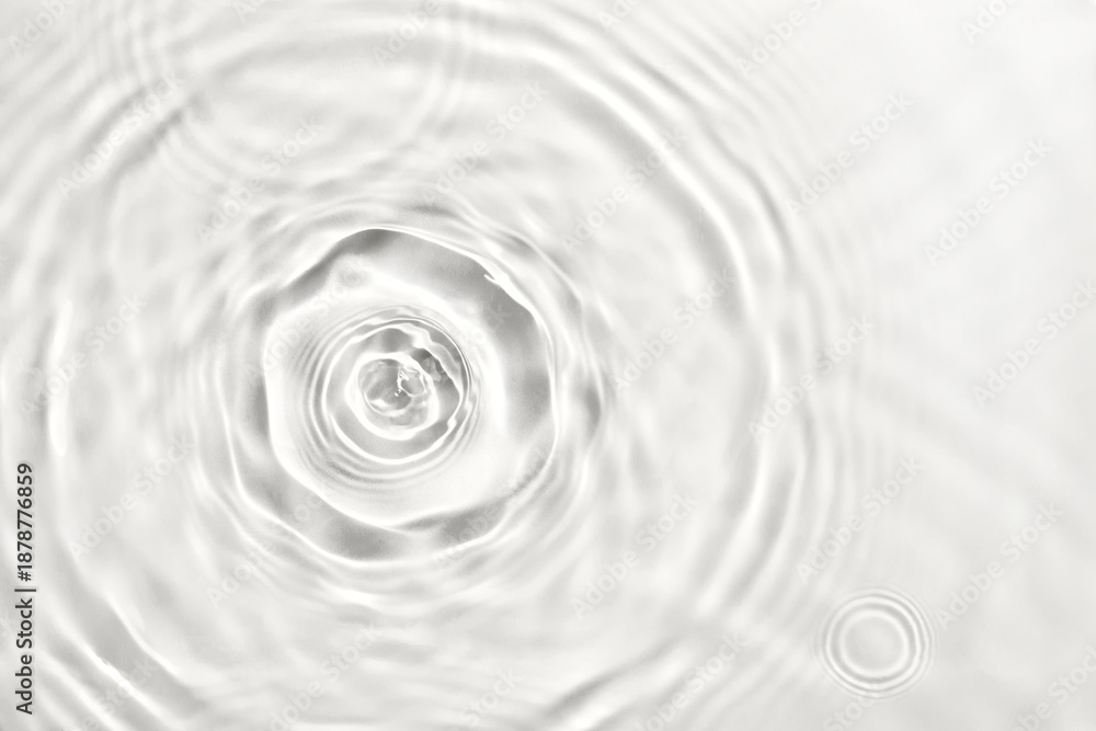 © colnihko - Water droplets creating ripples and waves on transparent background