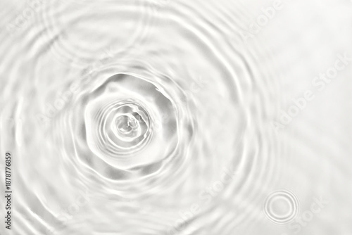 Water droplets creating ripples and waves on transparent background