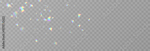 Falling holographic confetti. Shiny rainbow confetti PNG. Falling streamers or tinsel on an isolated transparent background.
