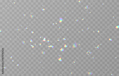 Falling holographic confetti. Shiny rainbow confetti PNG. Falling streamers or tinsel on an isolated transparent background.