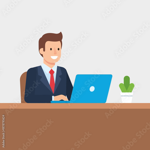 Happy businessman working on laptop at his desk in office with a potted plant