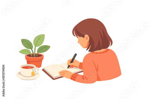 Girl studying or journaling at a desk with a plant and tea