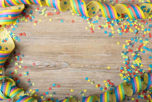 Colorful party frame with streamers and confetti